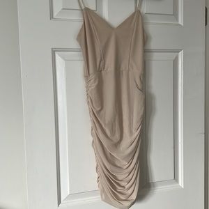Nude mesh lined ruched mini dress